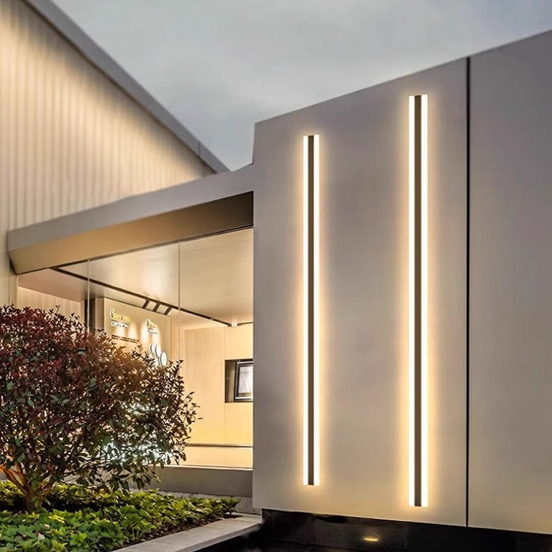 Minimalist linear LED wall light mounted on an exterior wall