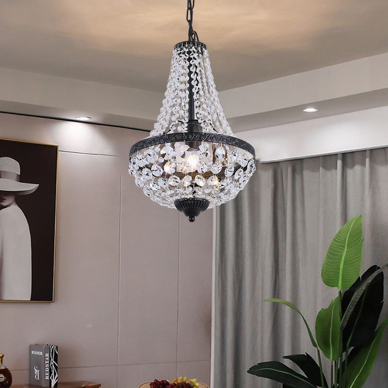 Neoclassical crystal island chandelier hanging above a table